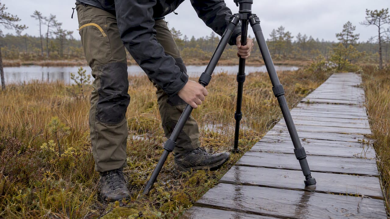 Tripod being secured on wet bog ground